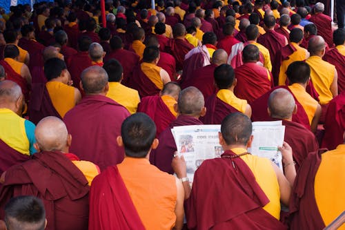 Group of Men Wearing Red and Yellow Shirt