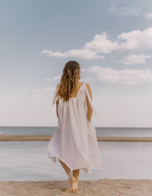 Woman in Dress on Beach