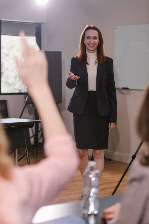 confident woman speaking up in a meeting