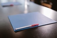 Pen on Top of a Folder
