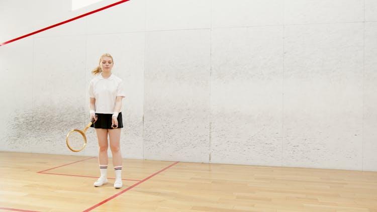 A Young Woman Playing Squash