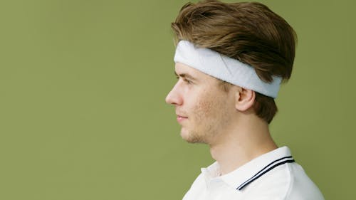 Side View of a Young Man Wearing a Headband