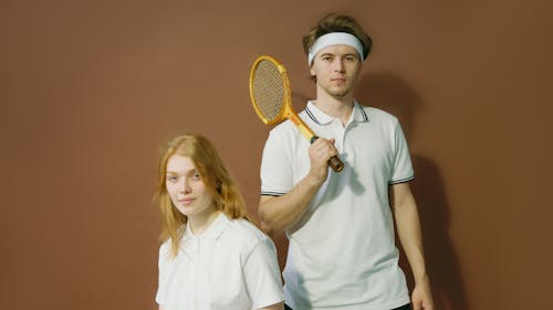 Woman and Man with Tennis Racket