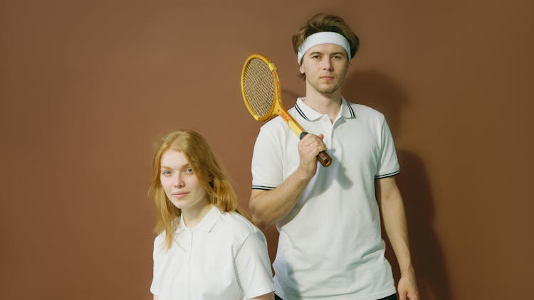 Woman And Man With Tennis Racket