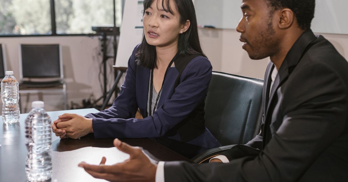 Business professionals engage in a productive meeting in an office setting.