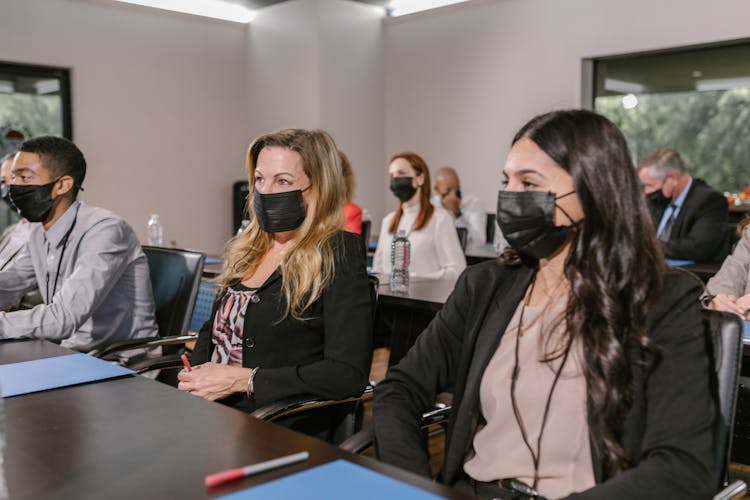 Participants Of A Conference In Face Masks