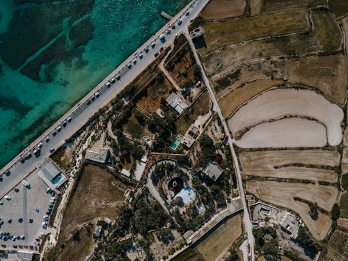 Birds-eye View of Cars on the Road near Body of Water