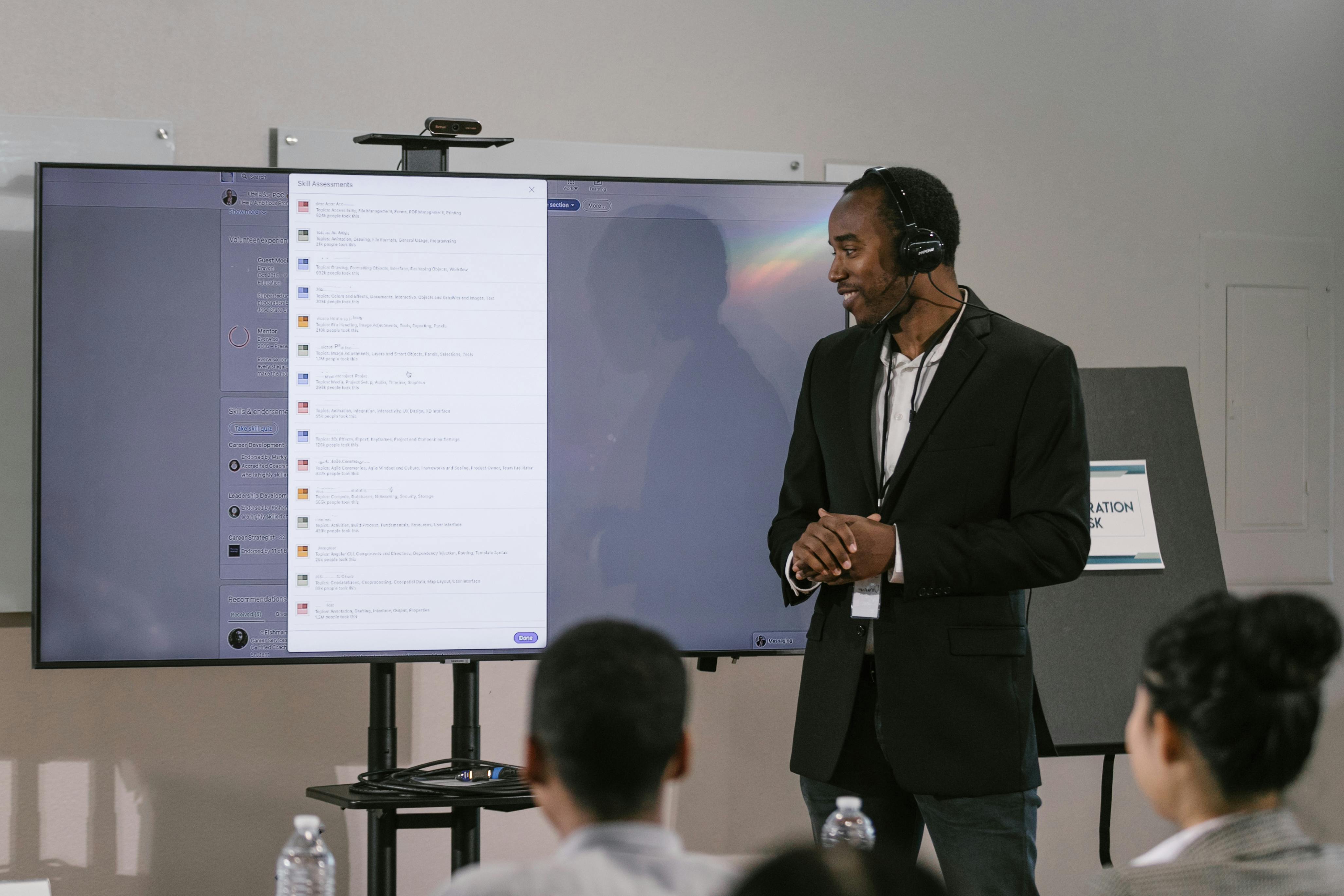 A Man in a Suit doing a Digital Presentation