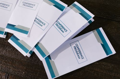 Printed tri-fold conference program brochures
