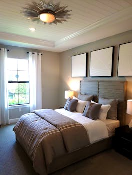 Stylish bedroom interior featuring neutral tones and contemporary decor.