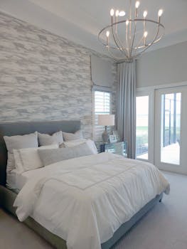 Modern bedroom with elegant decor, spacious layout, and natural light.