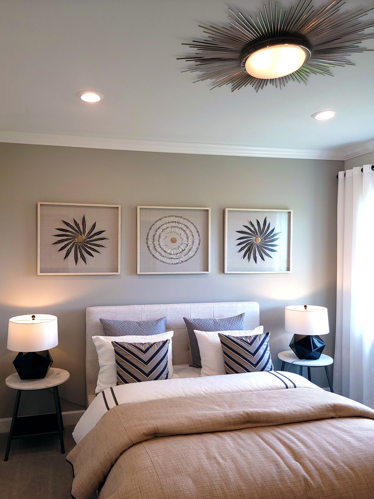 Gallery wall with framed artwork in a bedroom