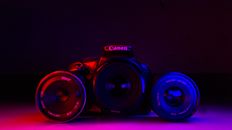 Black Nikon Dslr Camera on Blue Surface