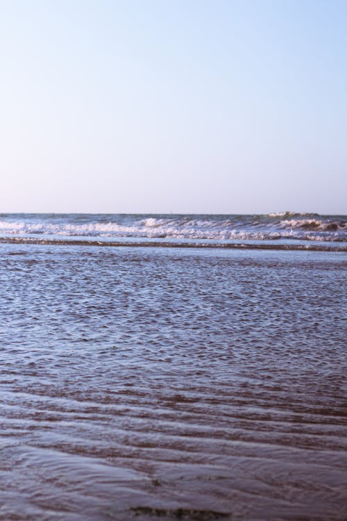 Photograph of Sand Near Sea Water