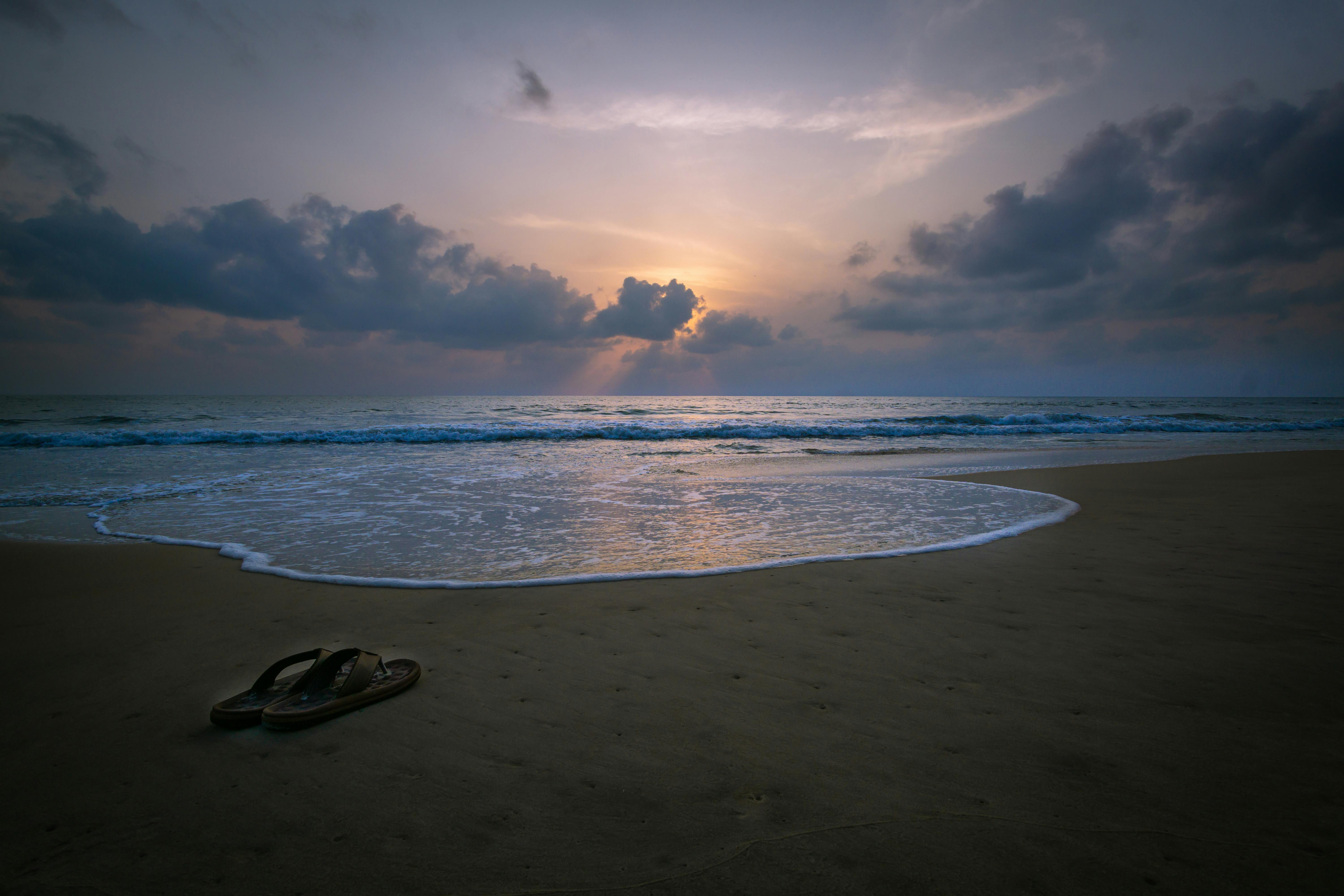 pair of slippers on shore