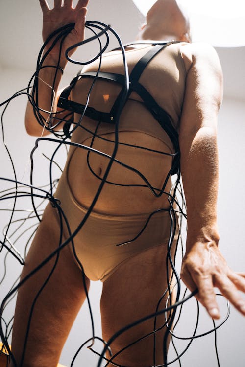 Wires Around a Woman Wearing a Bodysuit
