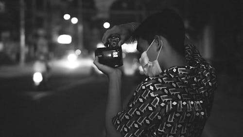 Free Monochrome Photo of a Man Taking Photos Stock Photo