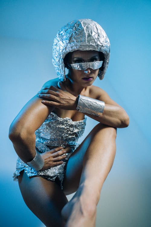 A Woman in a Futuristic Dress Posing