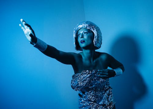 A Woman in a Futuristic Dress Posing