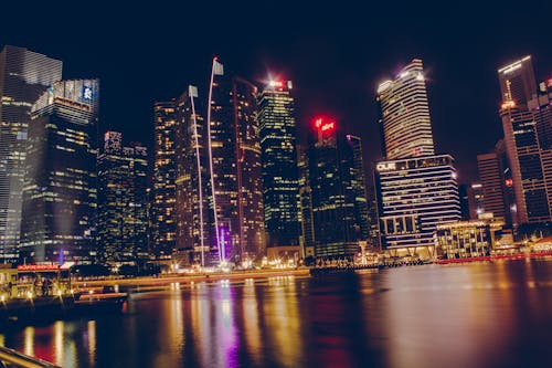 Free Photography Of High-Rise Building At Night Time Stock Photo