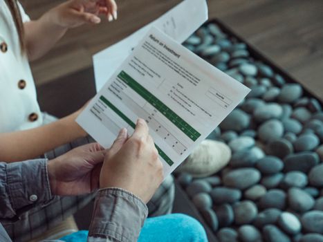 Two people discussing a financial document showing return on investment data.