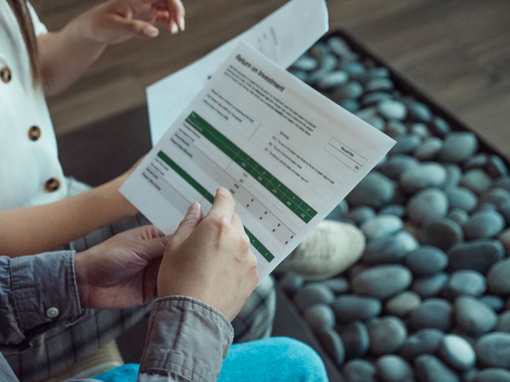 two people discussing financial document