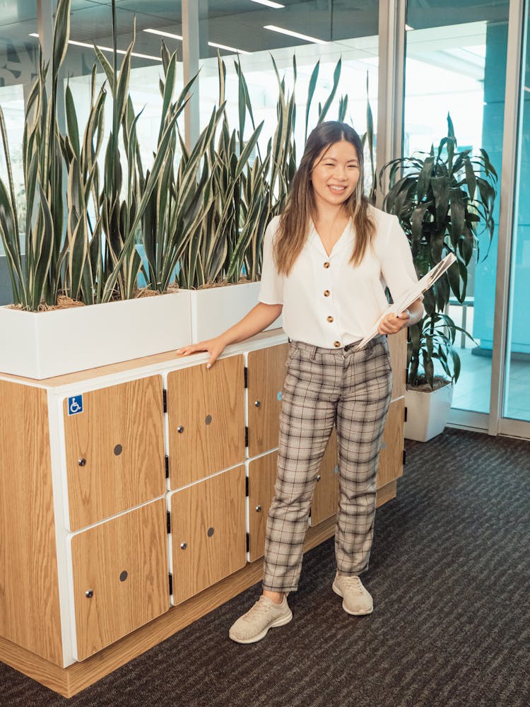 Woman Holding A Binder At The Office