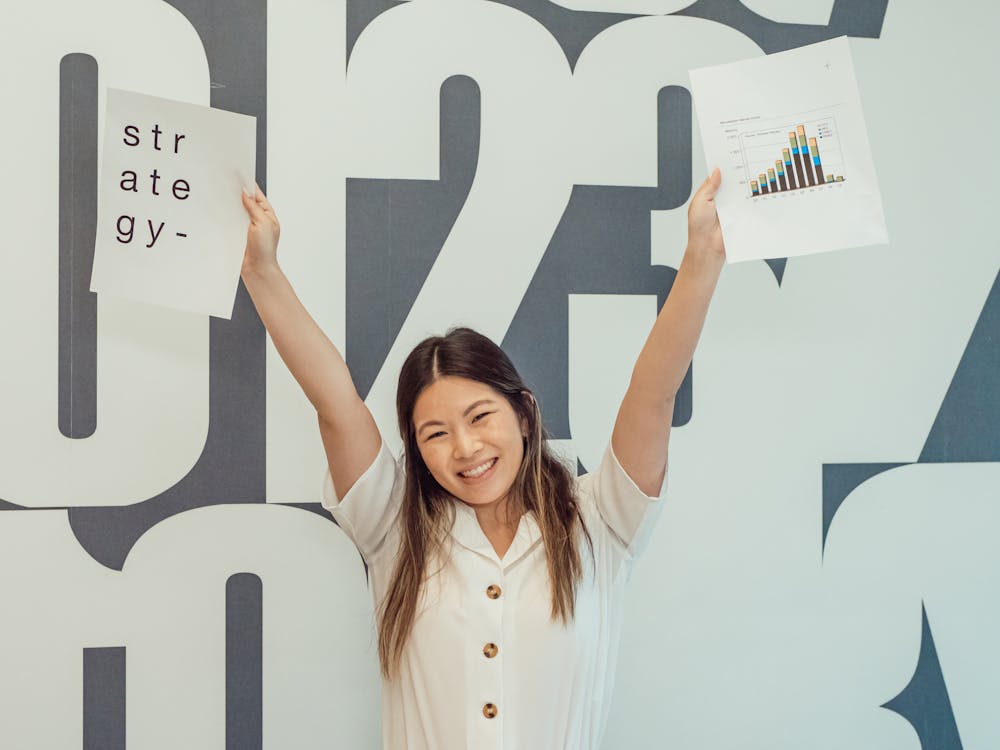Photo by Kindel Media from Pexels: Happily Raising her Hands