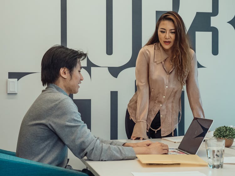 Two People Having A Meeting In The Office