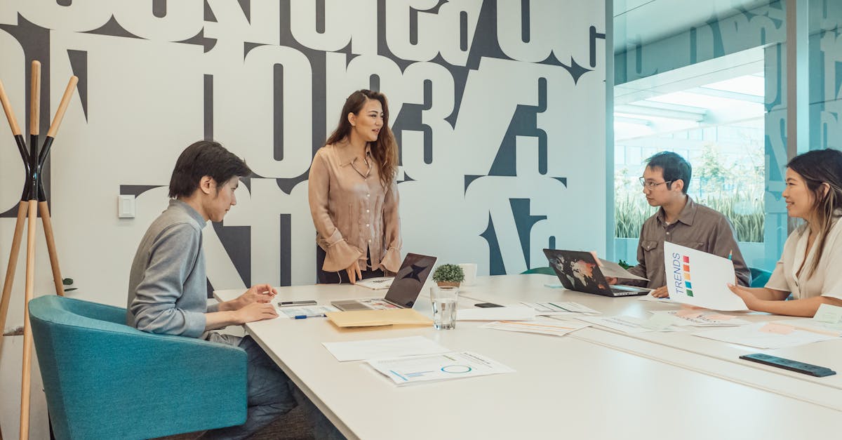 Diverse team engaged in brainstorming session in a modern office space.