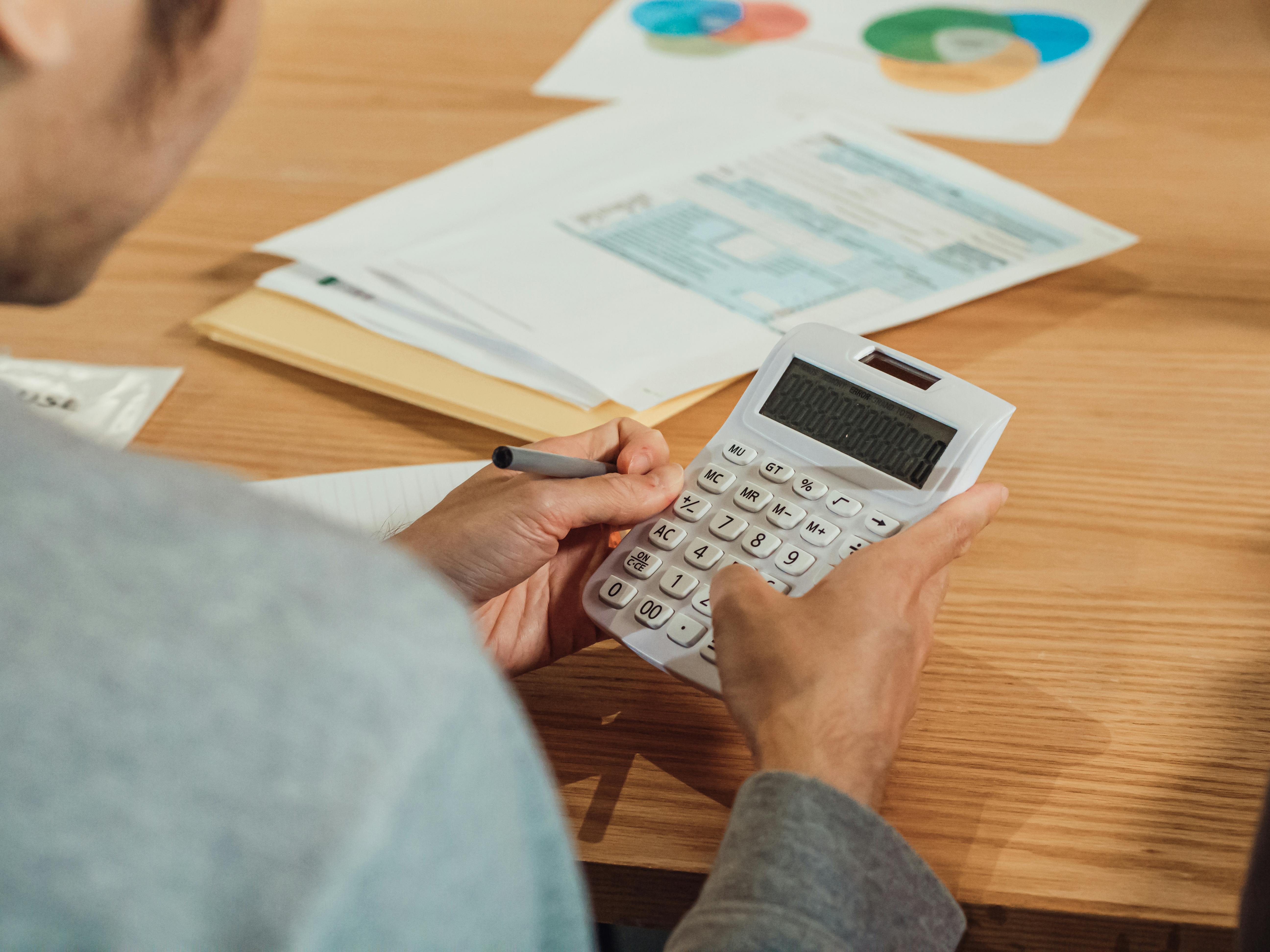 person using a calculator