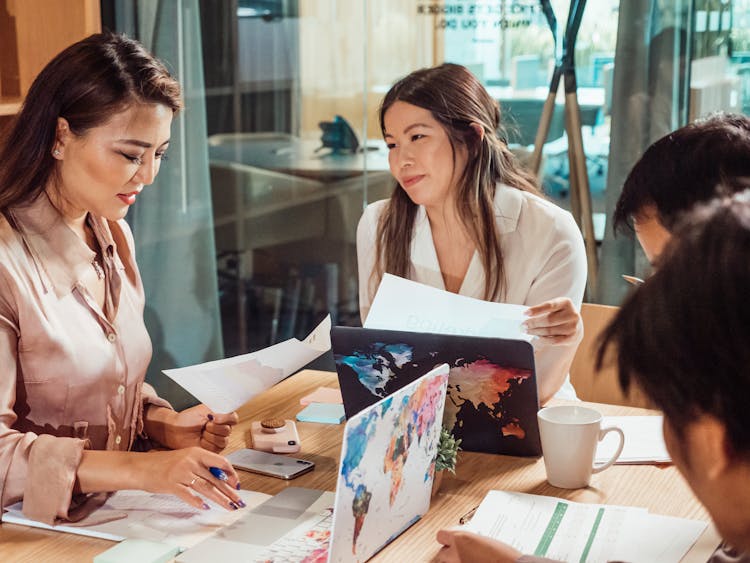 A Group Of People Having A Meeting In The Office