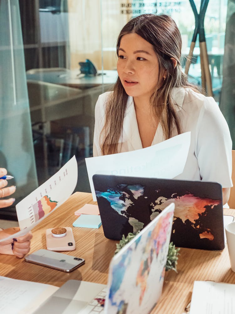 Woman In White Dress Shirt In A Business Meeting