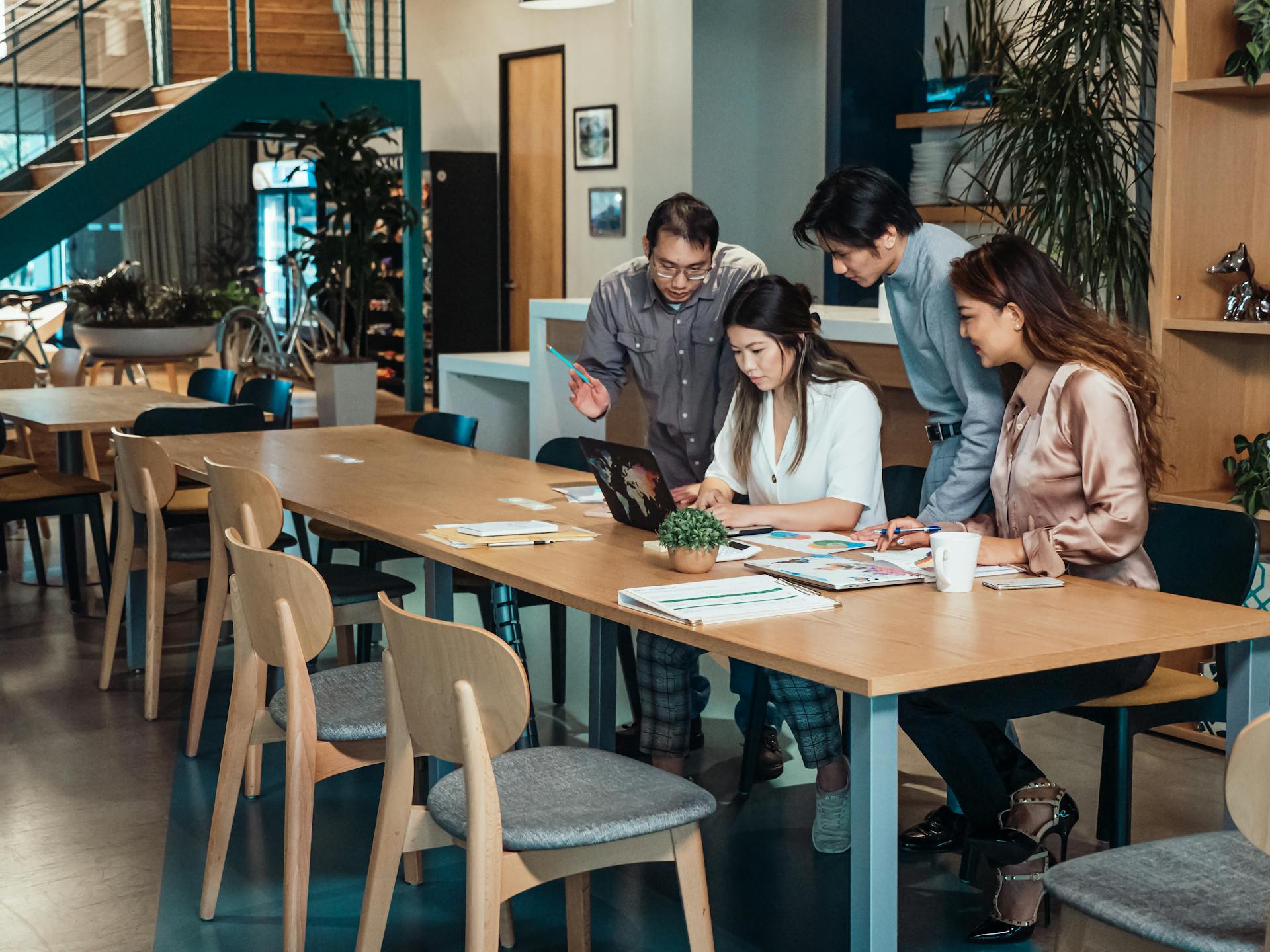 A Group of People Having a Meeting in the Office