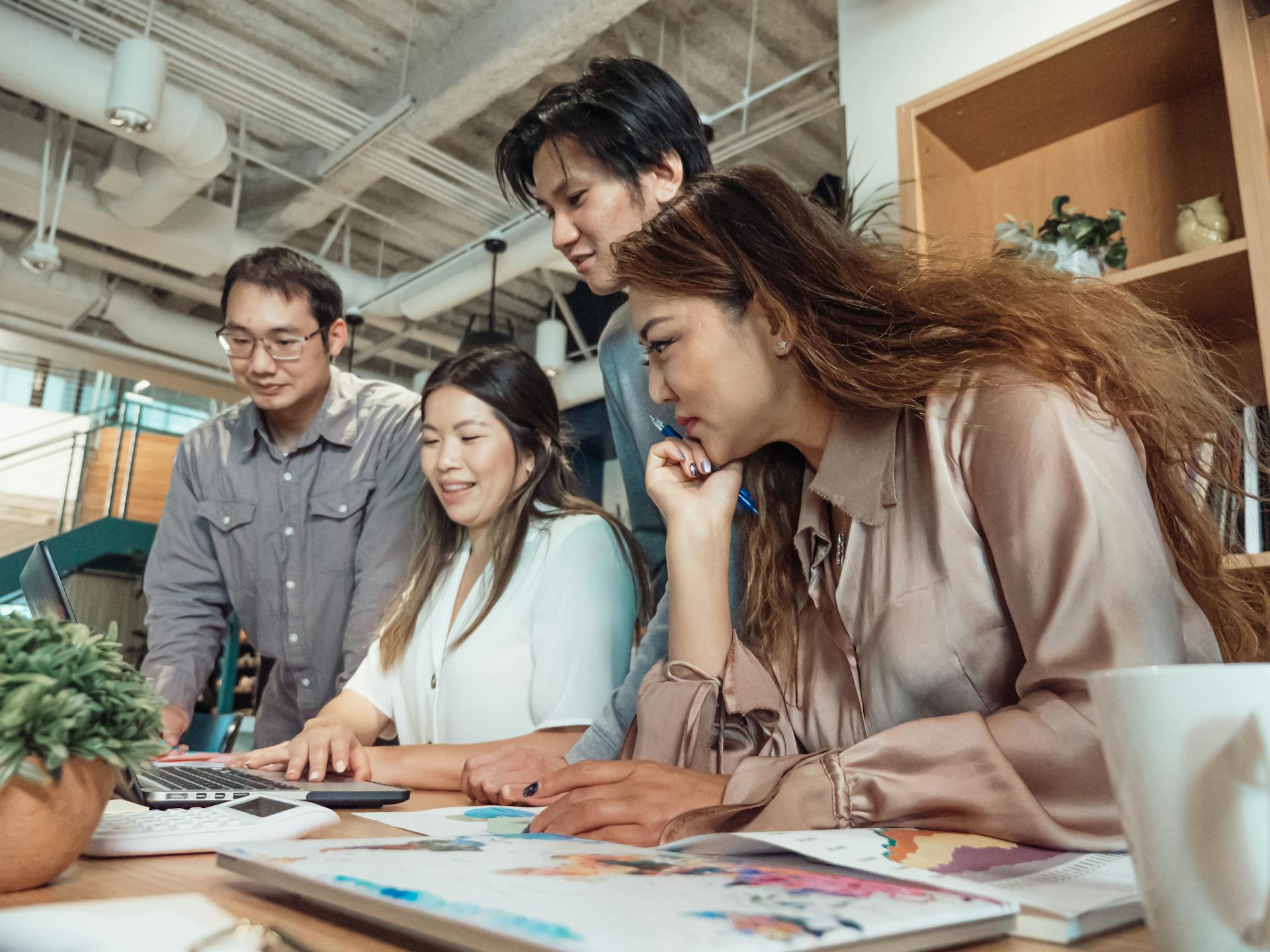 A Group of People Having a Meeting in the Office