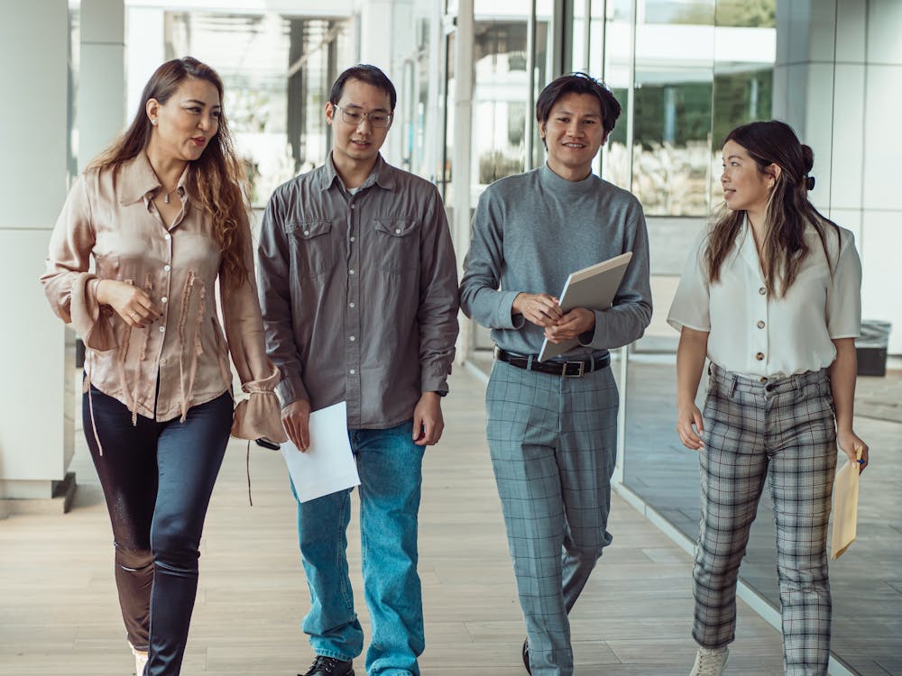 People Talking While Walking Outside · Free Stock Photo