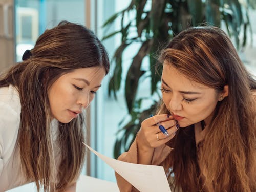 Free Two Women Having a Meeting in the Office Stock Photo