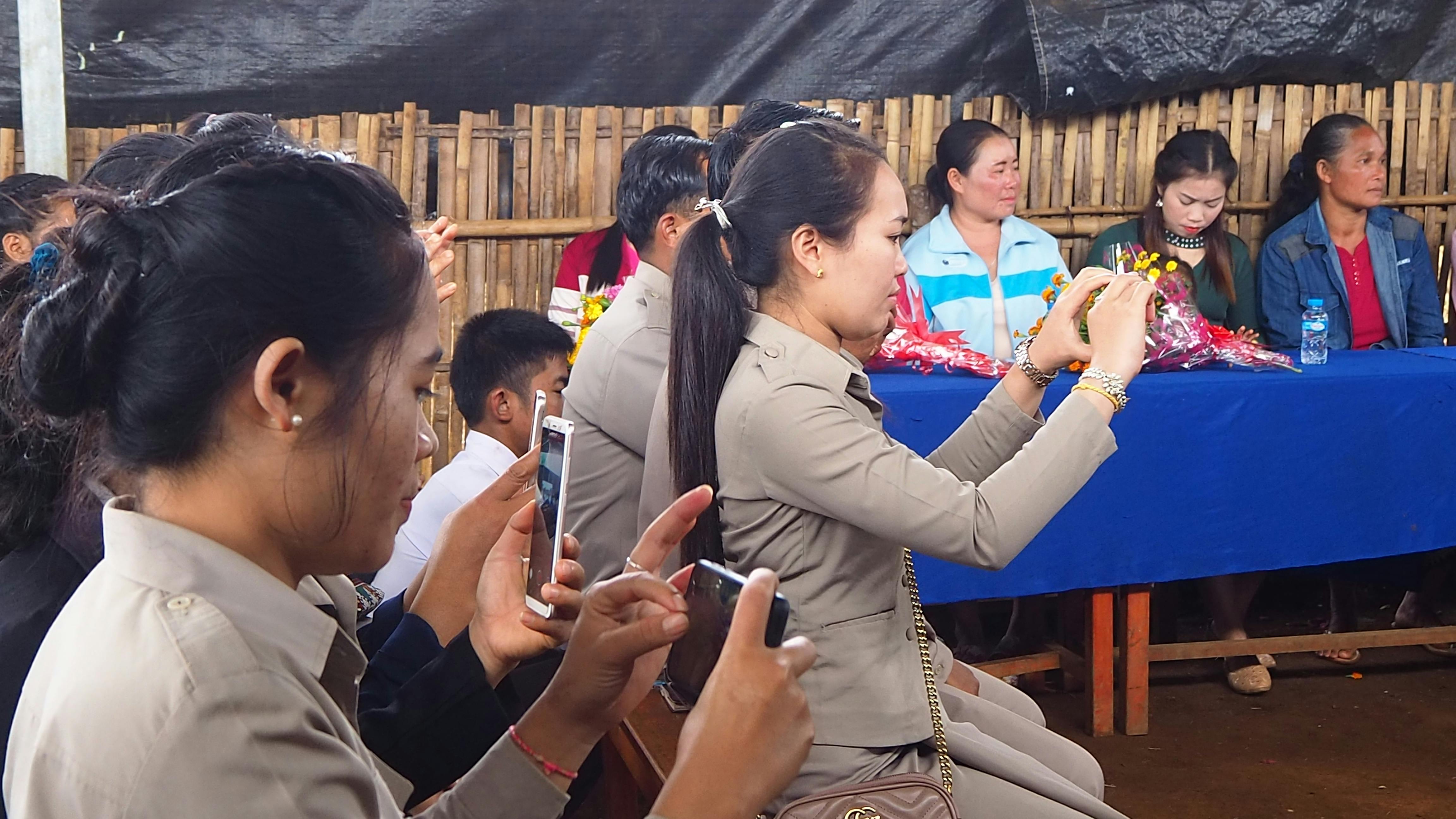 Technician inspecting computer components with a magnifier lamp in an electronics lab