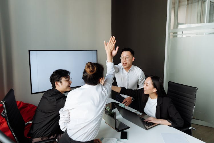 A Group Of People Having A Meeting In The Office