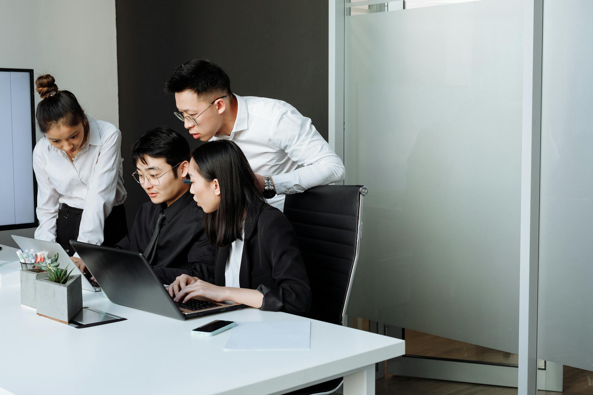 A Group of People Having a Meeting in the Office