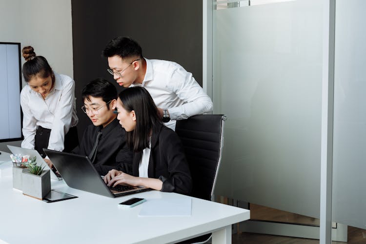 A Group Of People Having A Meeting In The Office