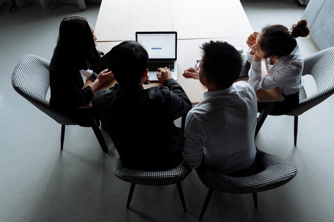 Free Overhead Shot of a Group of People Having a Meeting Stock Photo