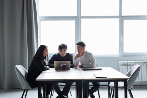 A Group of People Having a Meeting in the Office