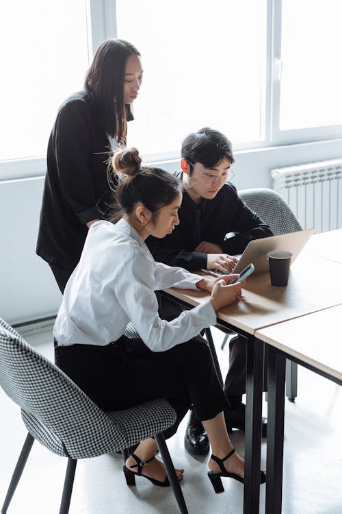 A Group of People Having a Meeting in the Office