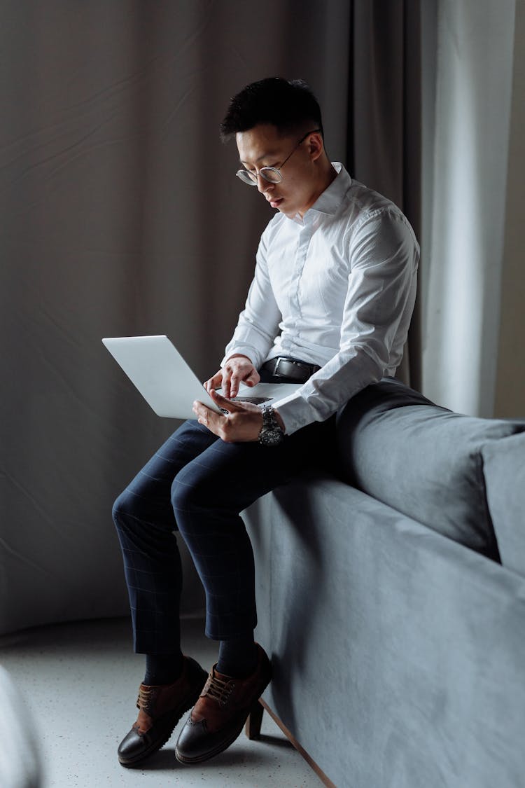 Man Typing On Laptop 