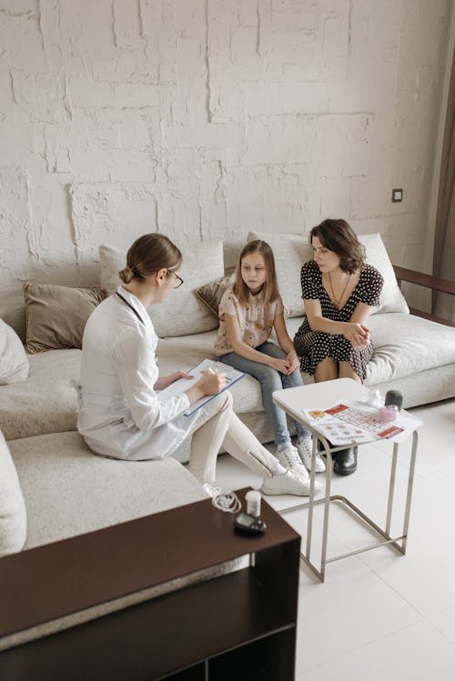 
A Doctor in a Consultation with a Mother and Her Daughter