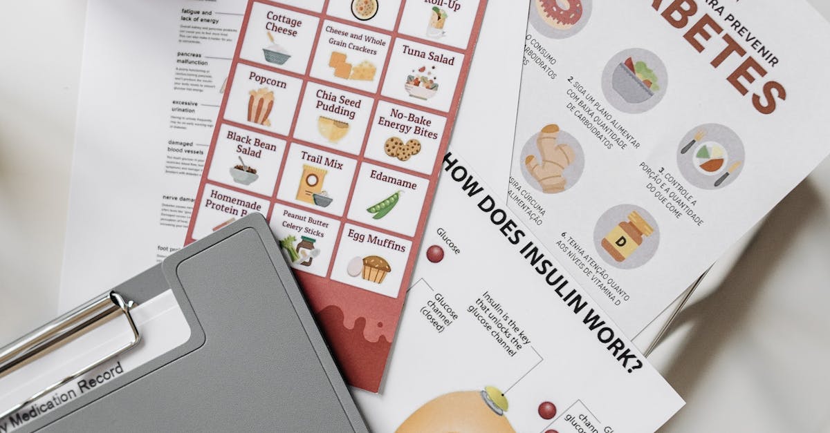 Top view of diabetes educational flyers on a table with a notepad and pen, offering health insights.