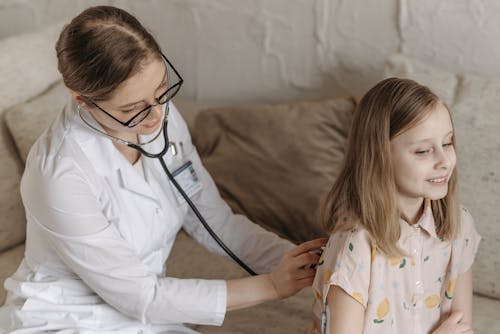 A Doctor Checking a Child