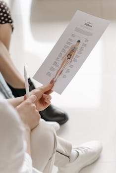 Hands holding a diabetes information sheet highlighting awareness and education.