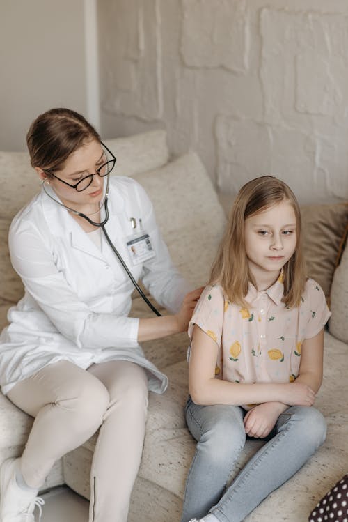 A Doctor Checking a Child